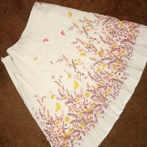 Off white floral skirt at the bottom